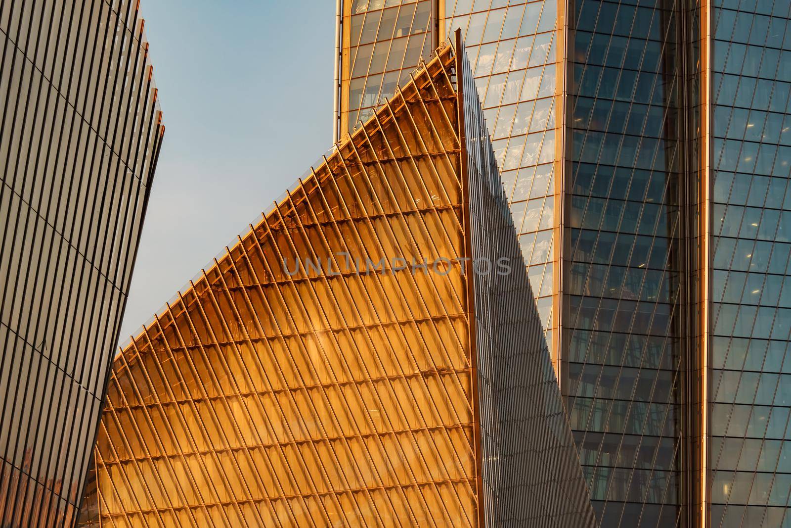 Russia, St. Petersburg, 10 June 2022: The skyscraper Lakhta center of the gas company Gazprom at sunset, glass and iron facade. High quality photo