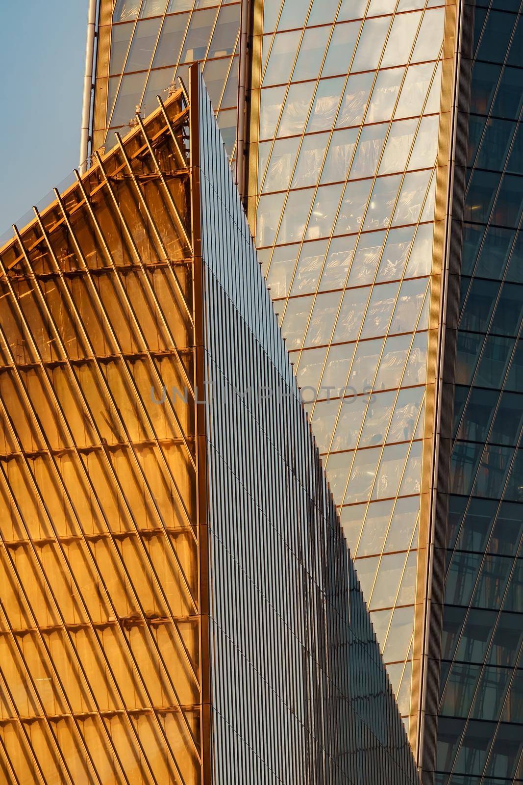 Russia, St. Petersburg, 10 June 2022: The skyscraper Lakhta center of the gas company Gazprom at sunset, glass and iron facade. High quality photo