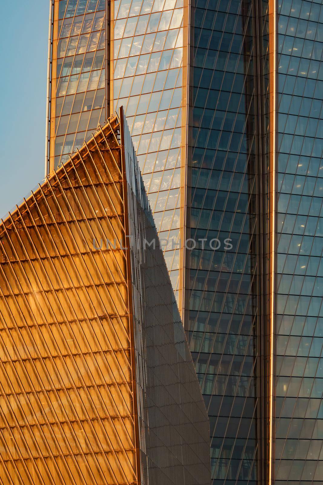 Russia, St. Petersburg, 10 June 2022: The skyscraper Lakhta center of the gas company Gazprom at sunset, glass and iron facade. High quality photo