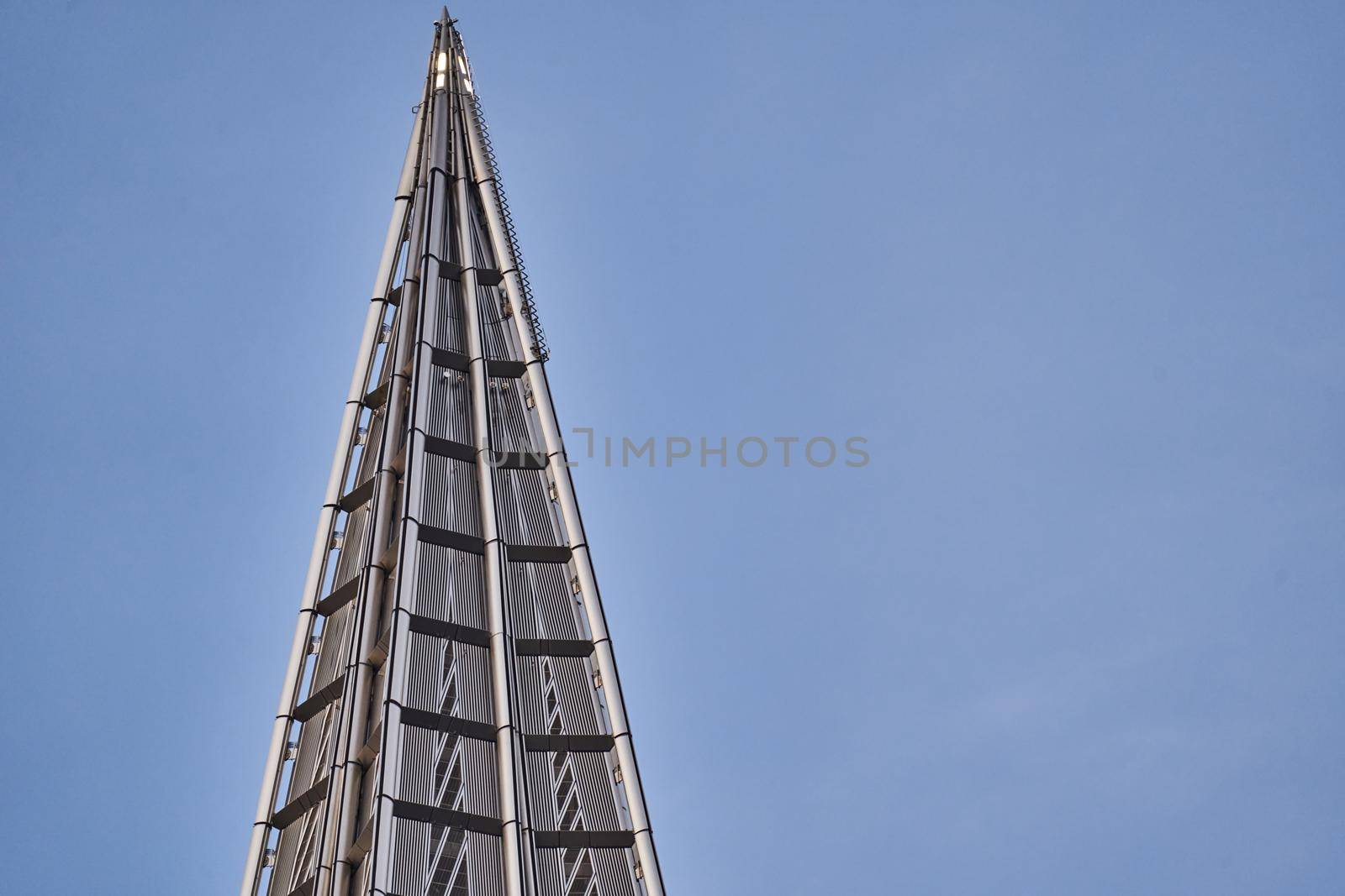 Russia, St. Petersburg, 10 June 2022: The skyscraper Lakhta center of the gas company Gazprom at sunset, glass and iron facade. High quality photo