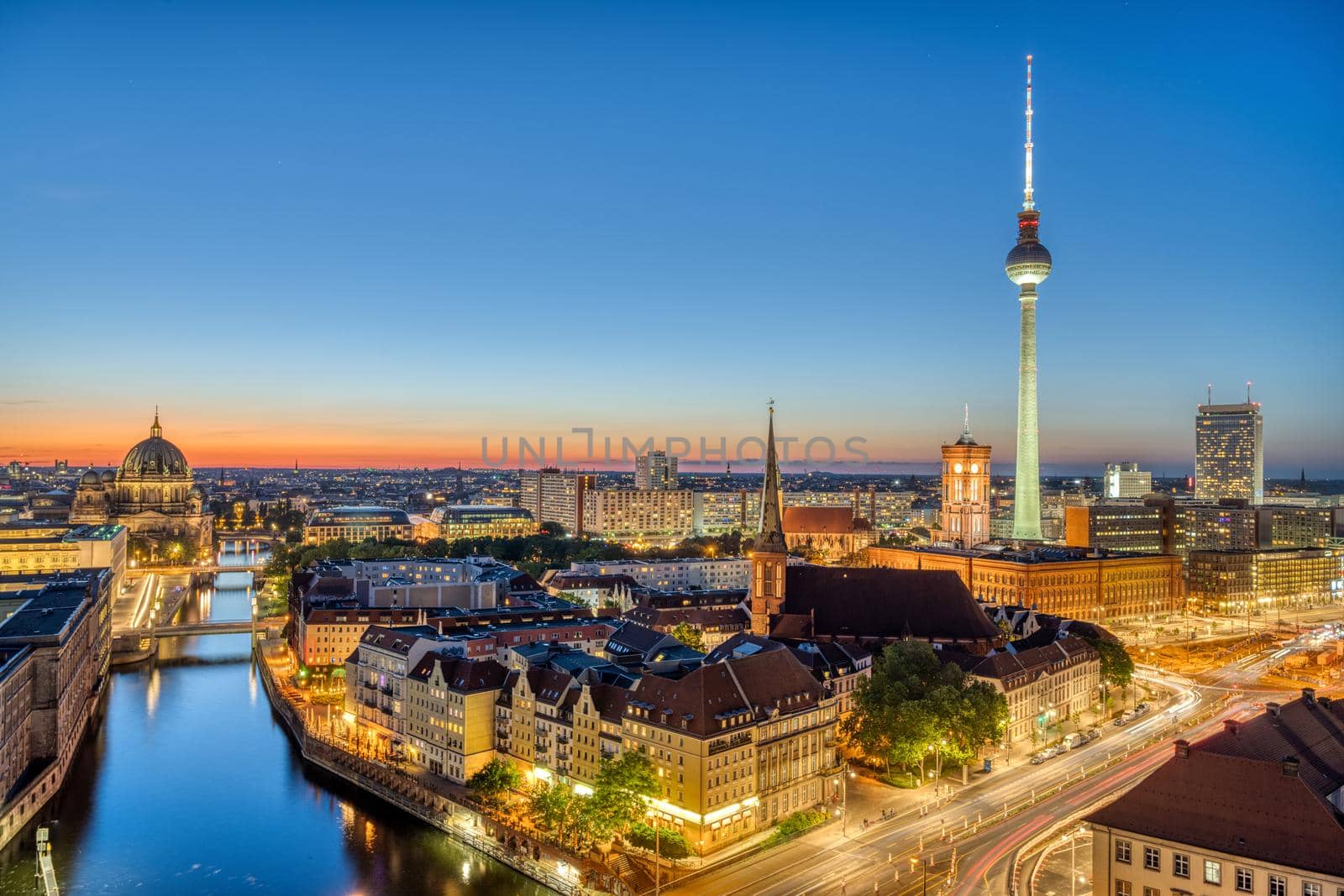 Downtown Berlin at dusk with the TV Tower, the river Spree and the cathedral
