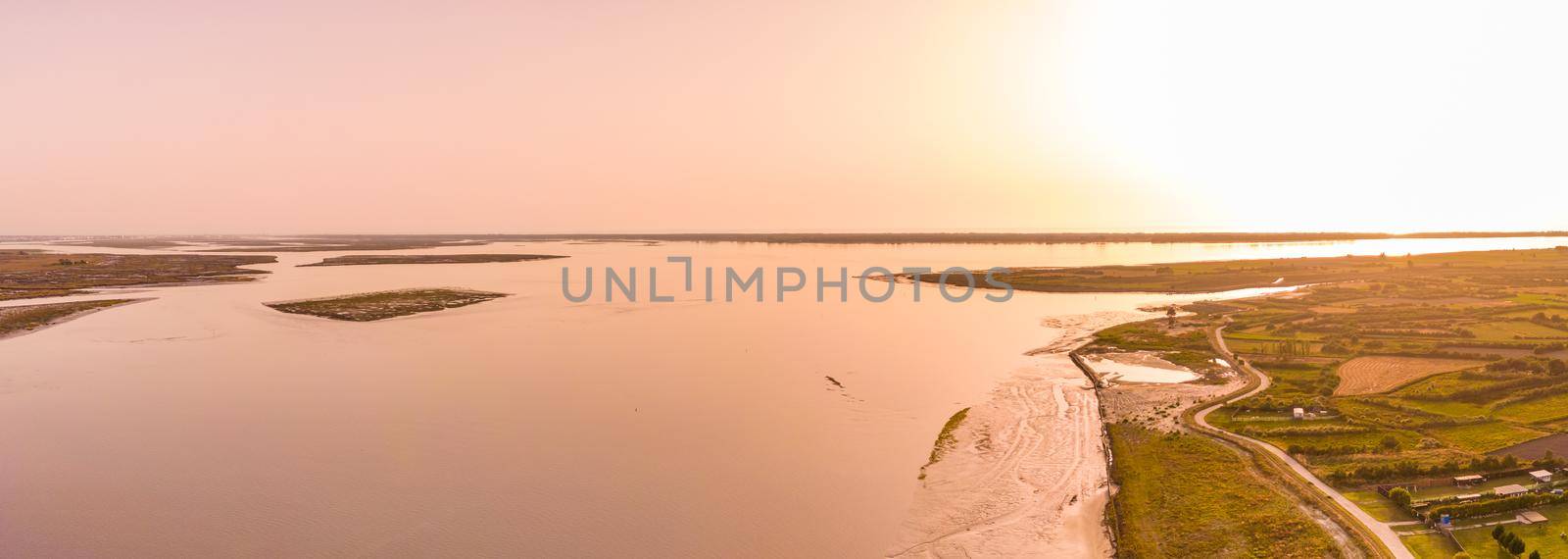 Aerial View of Aveiro Lagoon at sunset, view from Bico's beach in Murtosa, Aveiro, Portugal.