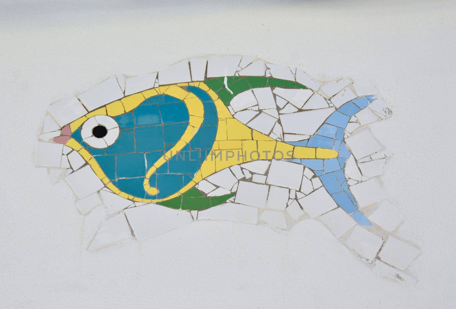 Mosaic of a colorful fish on the white background