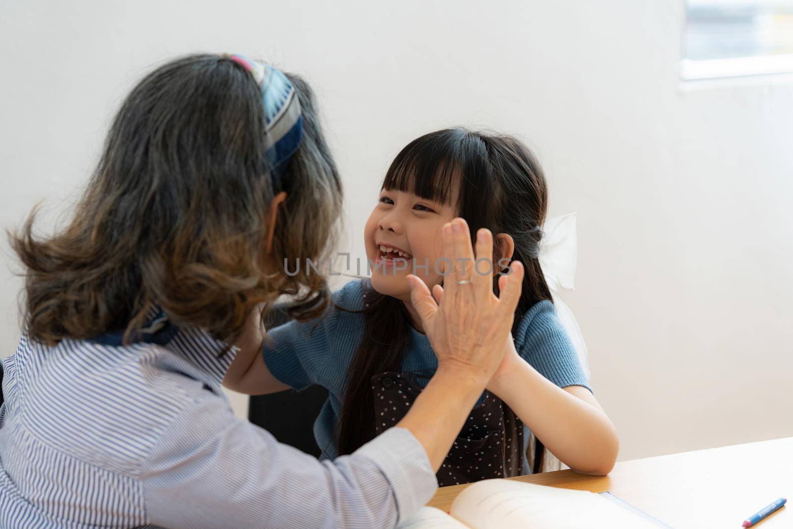 Happy moment of Daughter enjoying time together with mother at home. little child girl having fun