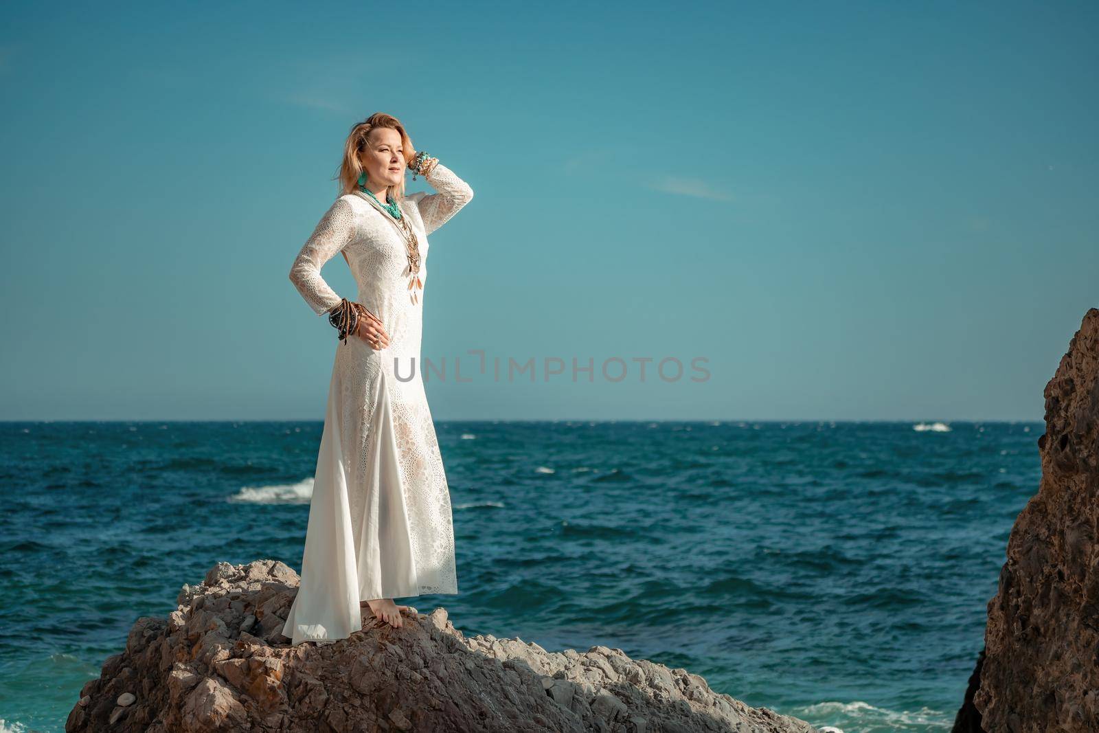 fashionable young model in boho style dress