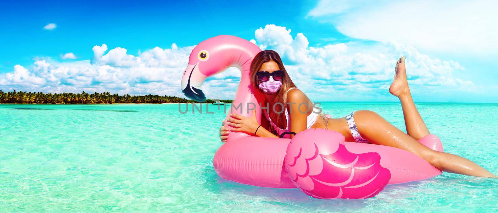 Beautiful tourist woman with corona virus mask and swan by Taut