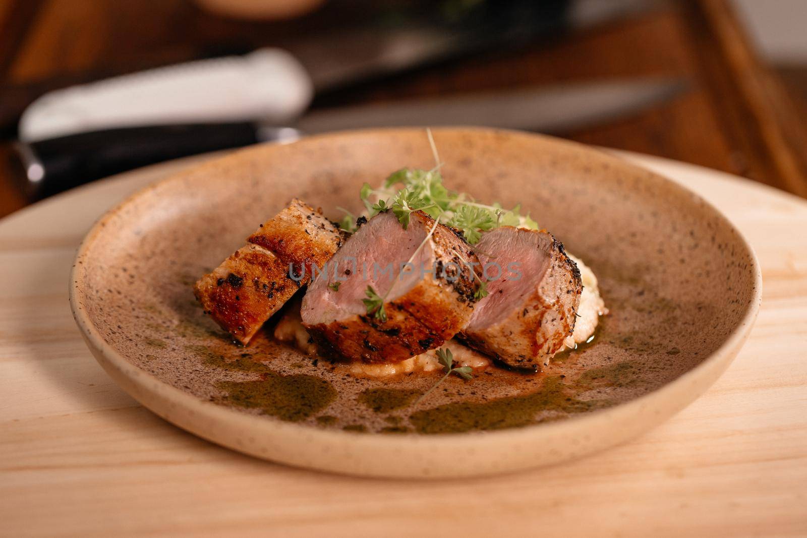 Pork Tenderloin Prepared for Serving, by RecCameraStock