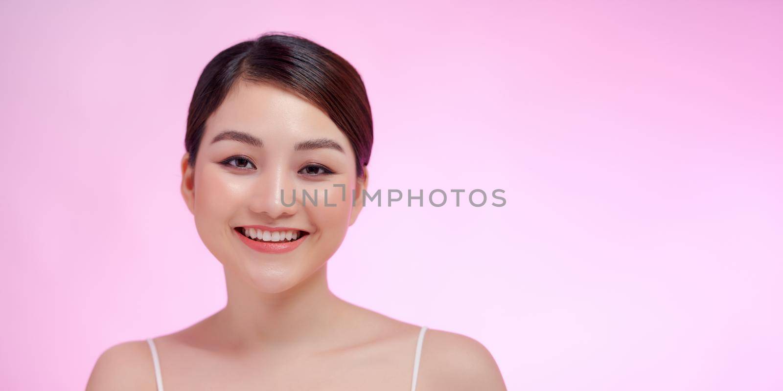Beautiful asian Spa Girl with empty copy space on pink by makidotvn