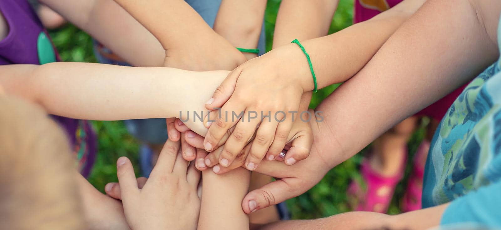 Children's hands together, street games. Selective focus. Kids.