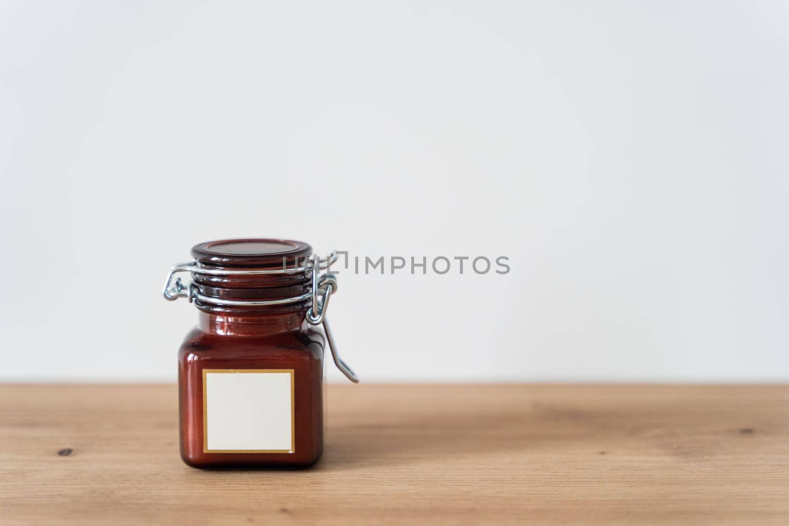 Scented candle in a glass jar on a white background by driver-s