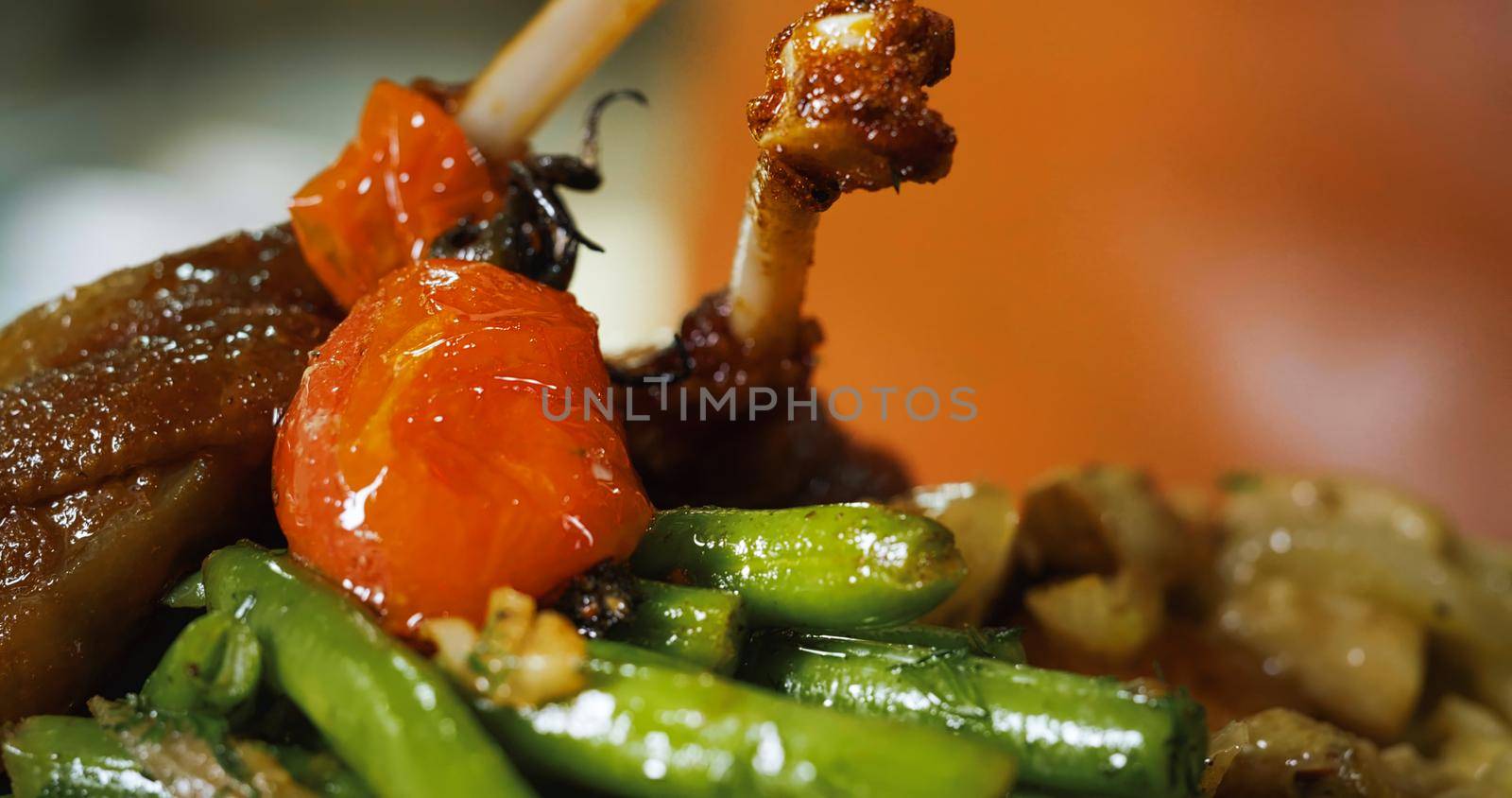 Appetizing Duck Meal Fried Tomato Decorated Close Up Details of Cooking.