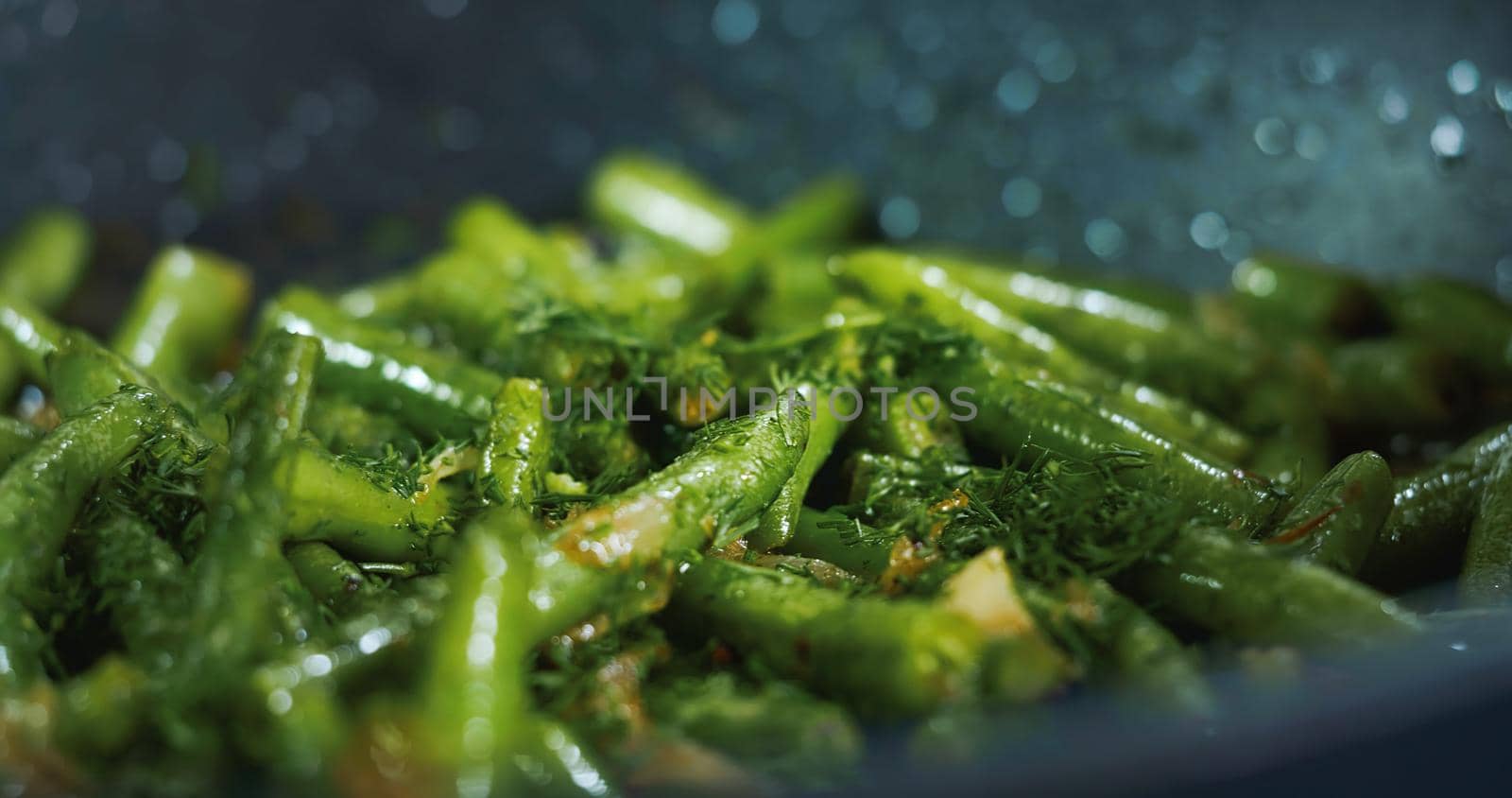 Cooked Green Beans Sprinkled with Dill . Close up Vegetarian Meals with Beans. by RecCameraStock