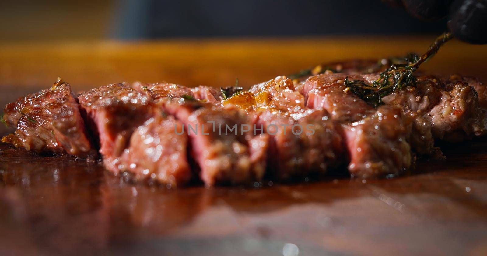 Chef Cutting a Medium Cooked Beef Looks Very Tasty Close Up About Food Art. by RecCameraStock