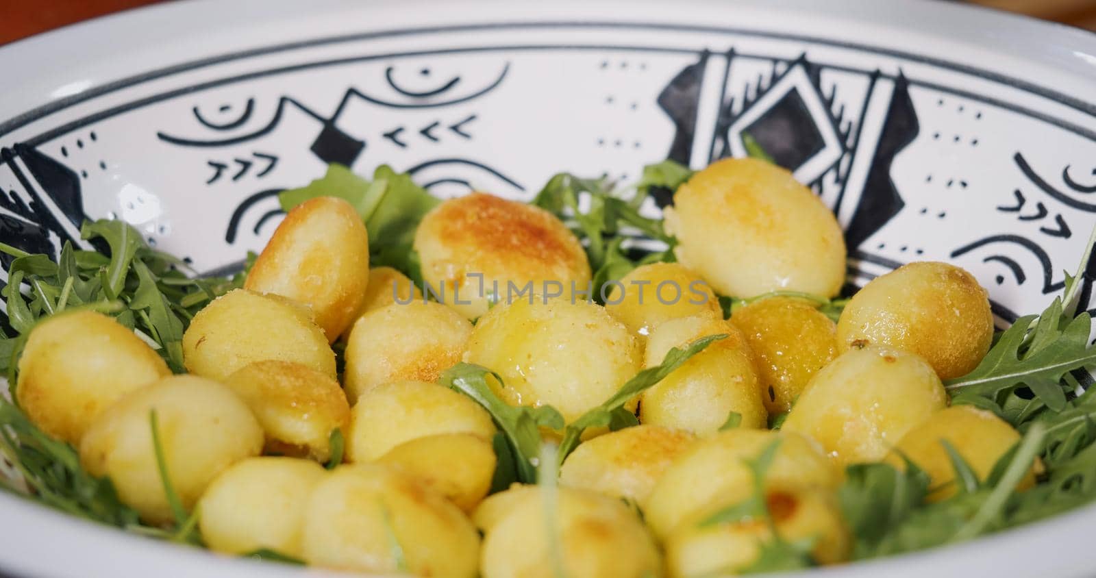 Heathy Food Vegetarian Concept. Fresh Arugula and cooked Potatoes Salad. by RecCameraStock