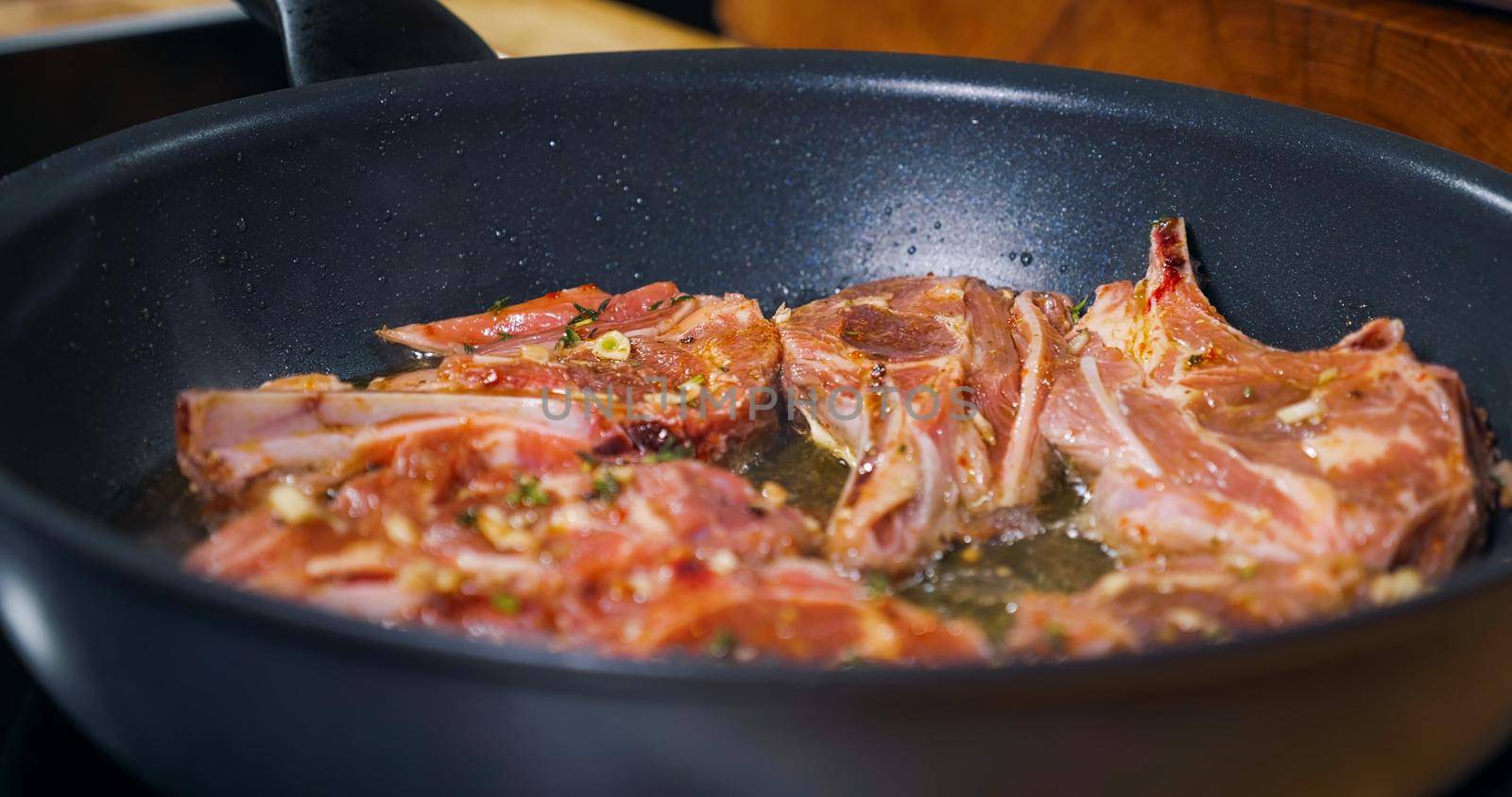 Lamb Cooking. Delicious Meat dish. Close Up. Appetizing Meat Dish. by RecCameraStock