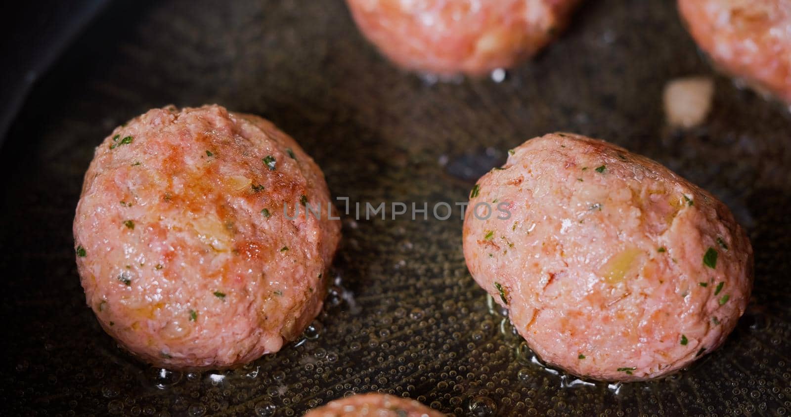 Tasty Meatballs Frying on Hot Pan Close Up by RecCameraStock