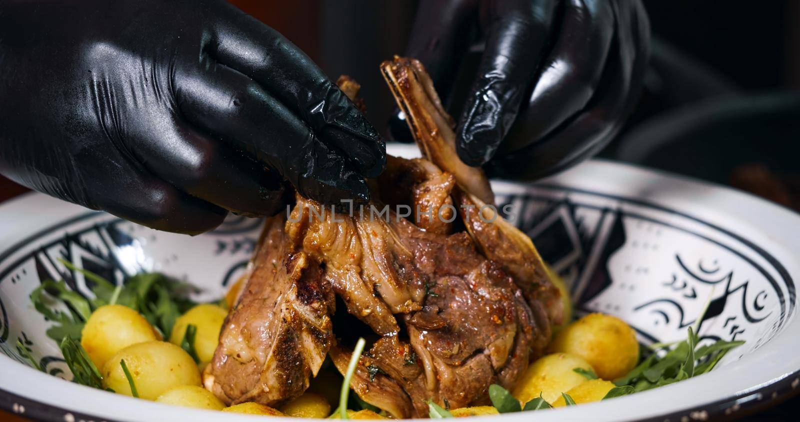 Lamb Ribs Meat Dish Served with Vegetables and Arugula. Appetizing cooked Meat. by RecCameraStock