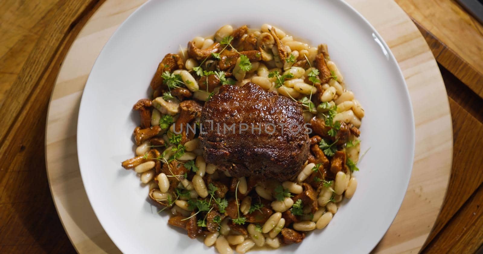 Top View of Food. White Plate with delicious Beef Food dish. Food Preparation by RecCameraStock