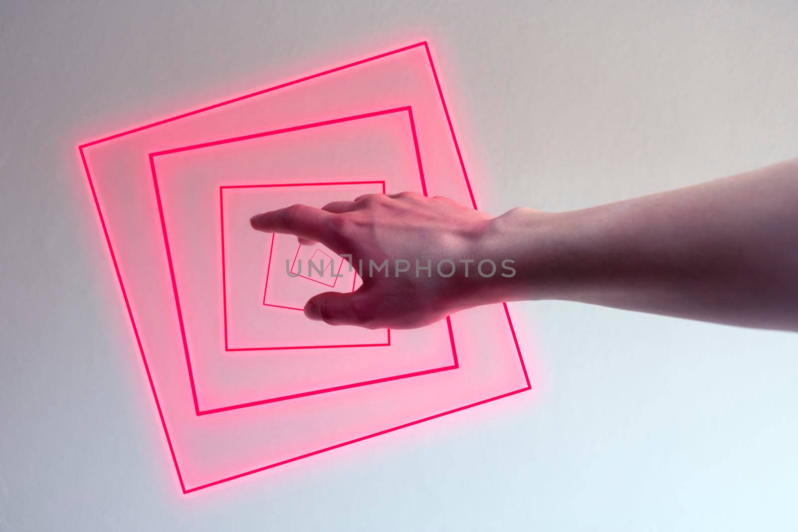 Hand entering in a neon light as a gate for new dimensions. Concept of new contemporary technology like metaverse, augmented reality and artificial intelligence.