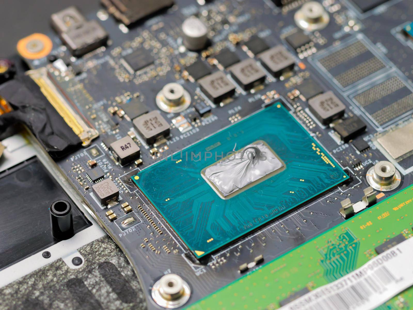 Thermal paste on the laptop processor. Computer literacy repair men hands, cooling the hot temperature of the laptop