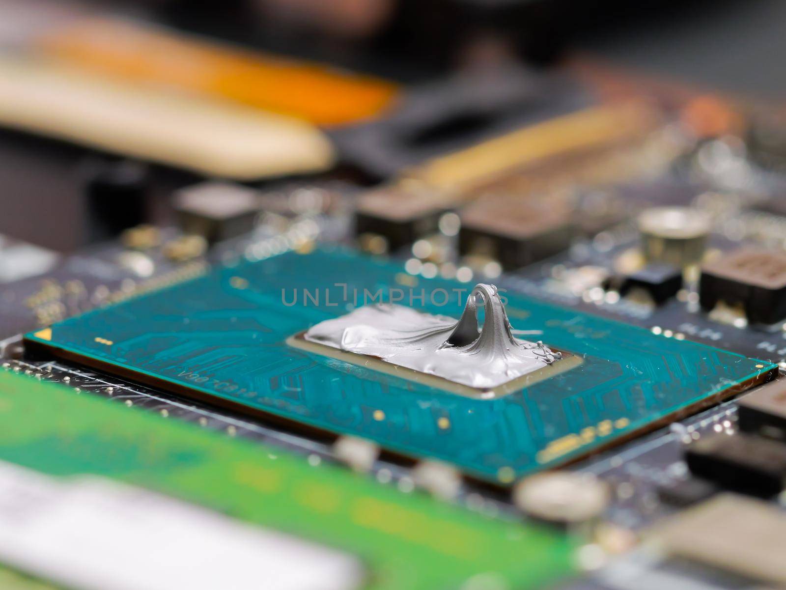 Thermal paste on the processor. The concept of laptop CPU hardware, repairing, upgrade and technology.
