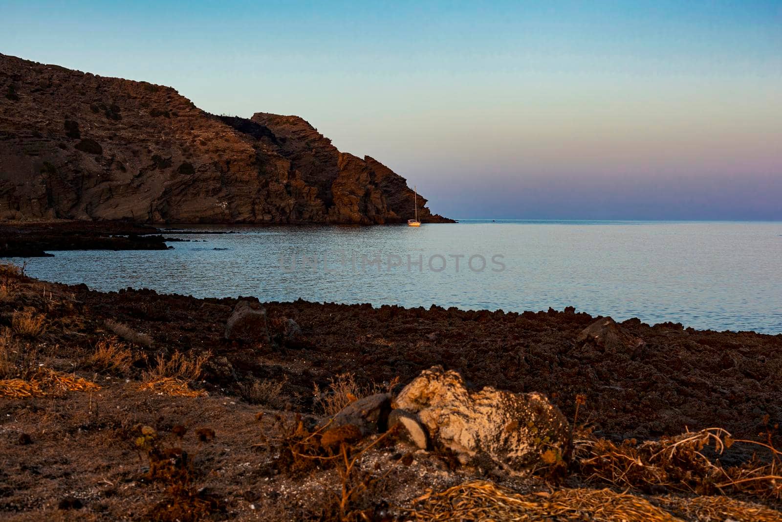 Typical beach with lava in the sea of Linosa one of the Pelagie Islands in the Sicily Channel of the Mediterranean Sea