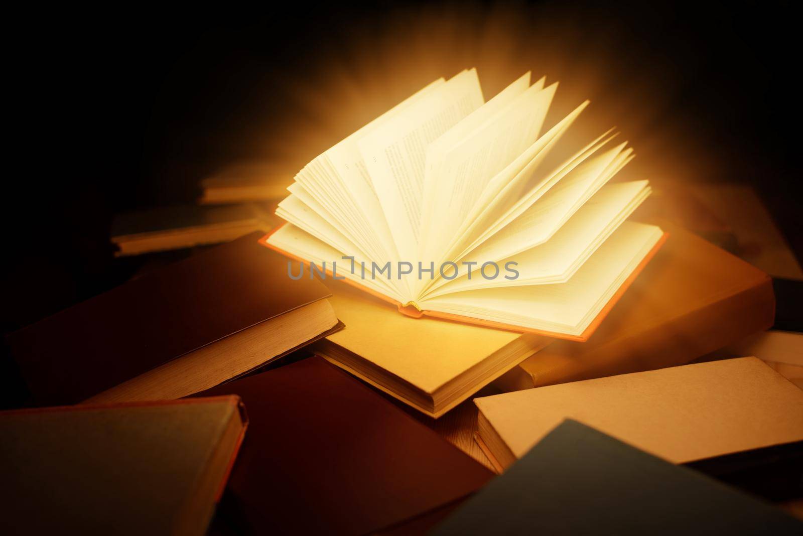 Bright light coming from open book, making image overexposed by VitaliiPetrushenko