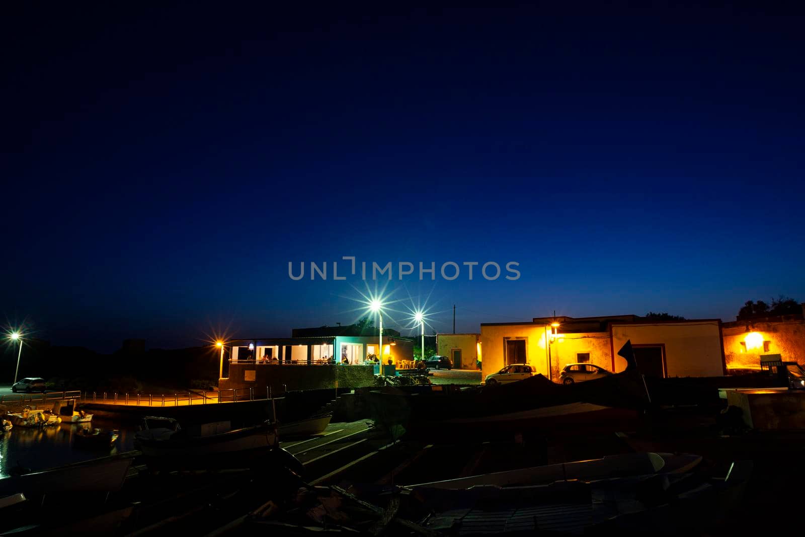 Night view of the Linosa old pier, Pelagie islands. Sicily