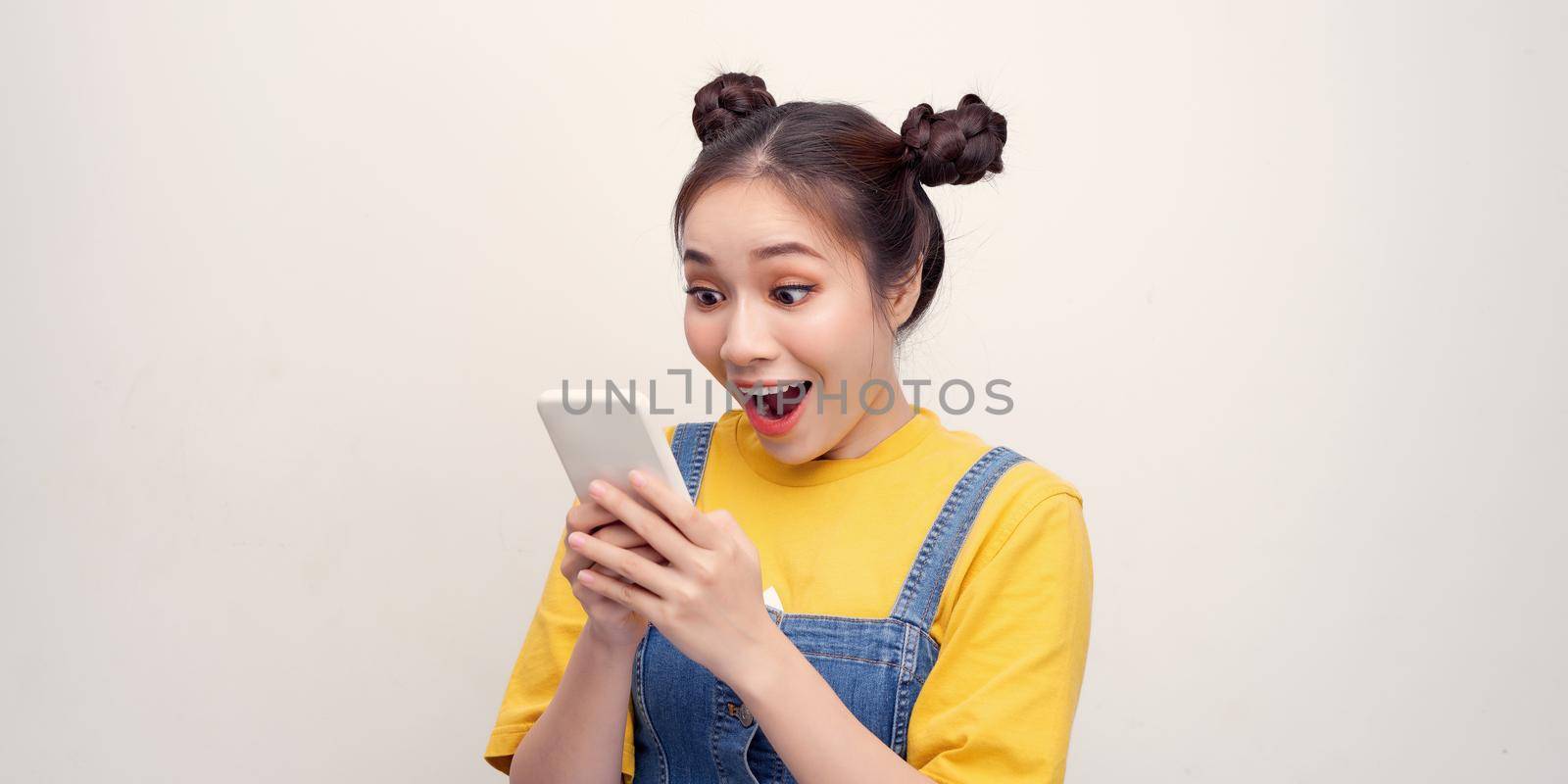 Photo of pretty funny excited lady open mouth hold telephone post youth blog read comments isolated white color background