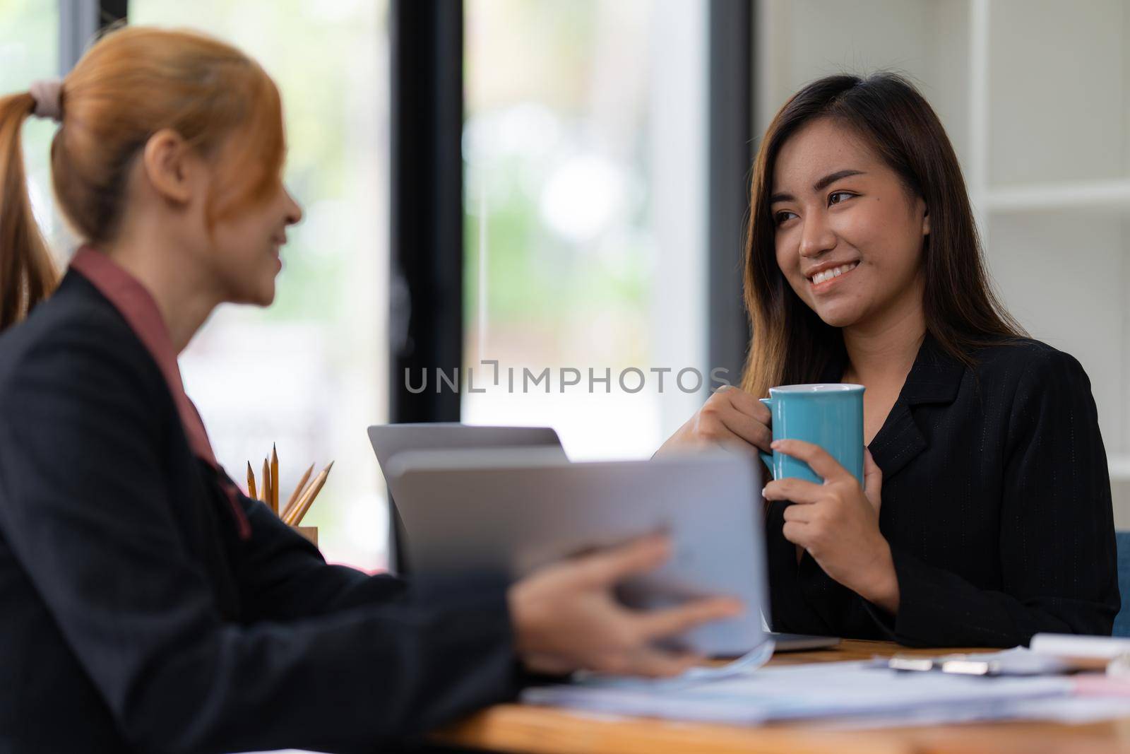 Cheerful business people discussing or brainstorming about marketing plan and financial of company. Account concept