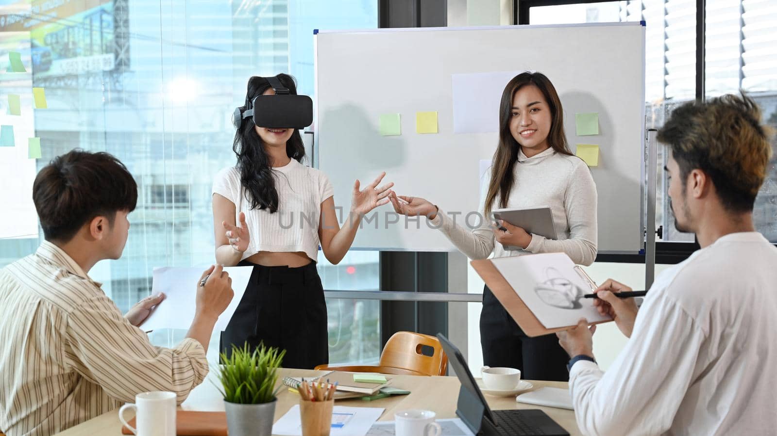 Creative business team is brainstorming for augmented reality improvement, future technology for business. Concept of people and augmented reality.