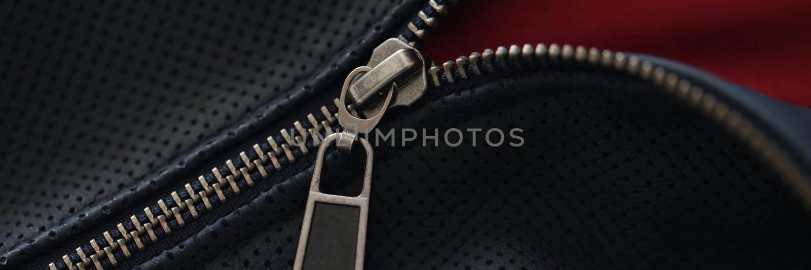 Closeup of zipper on blue leather jacket by kuprevich