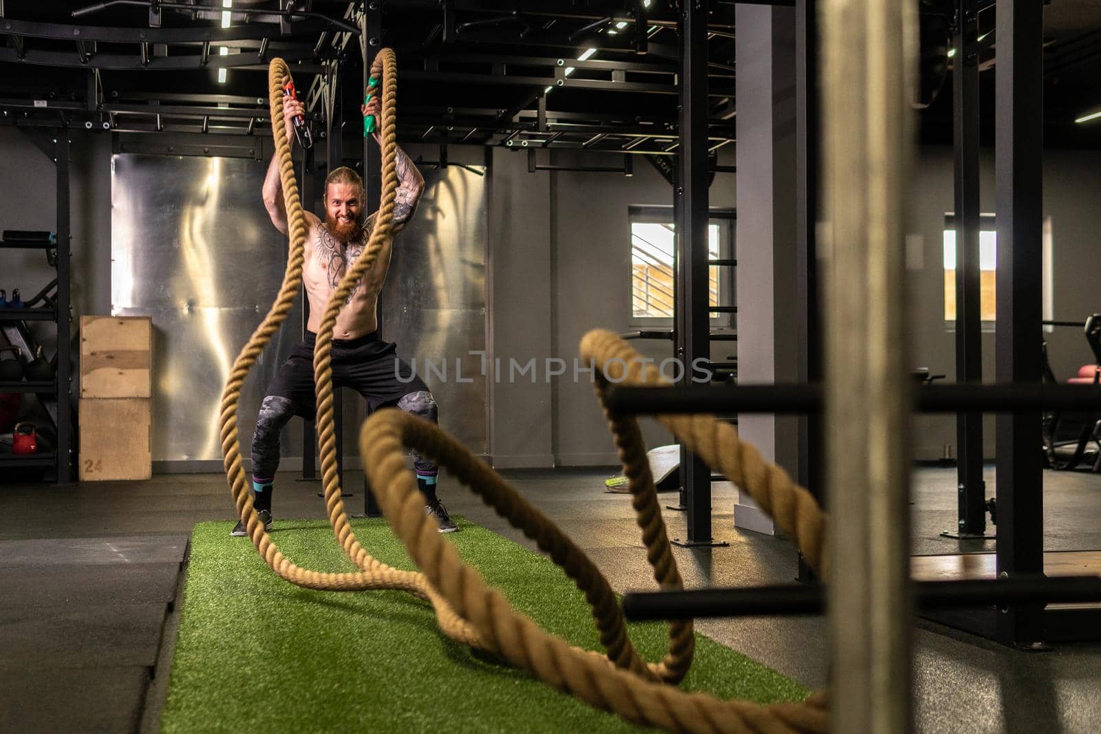 Rope man grass warehouse green fitness training gym exercising exercise, for athlete one from male from healthy moving, sport muscle. Standing ground holding, lifestyles