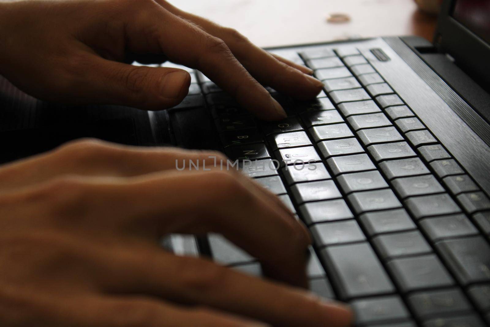 woman using laptop, searching web, browsing information, having workplace at home. soft focus picture..