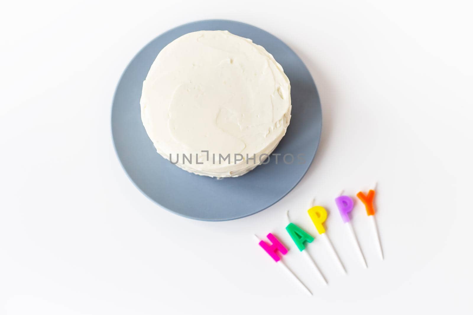 Preparing for a birthday cake, the inscription happiness on a creamy biscuit. Surprise holiday and birthday concept. by sfinks