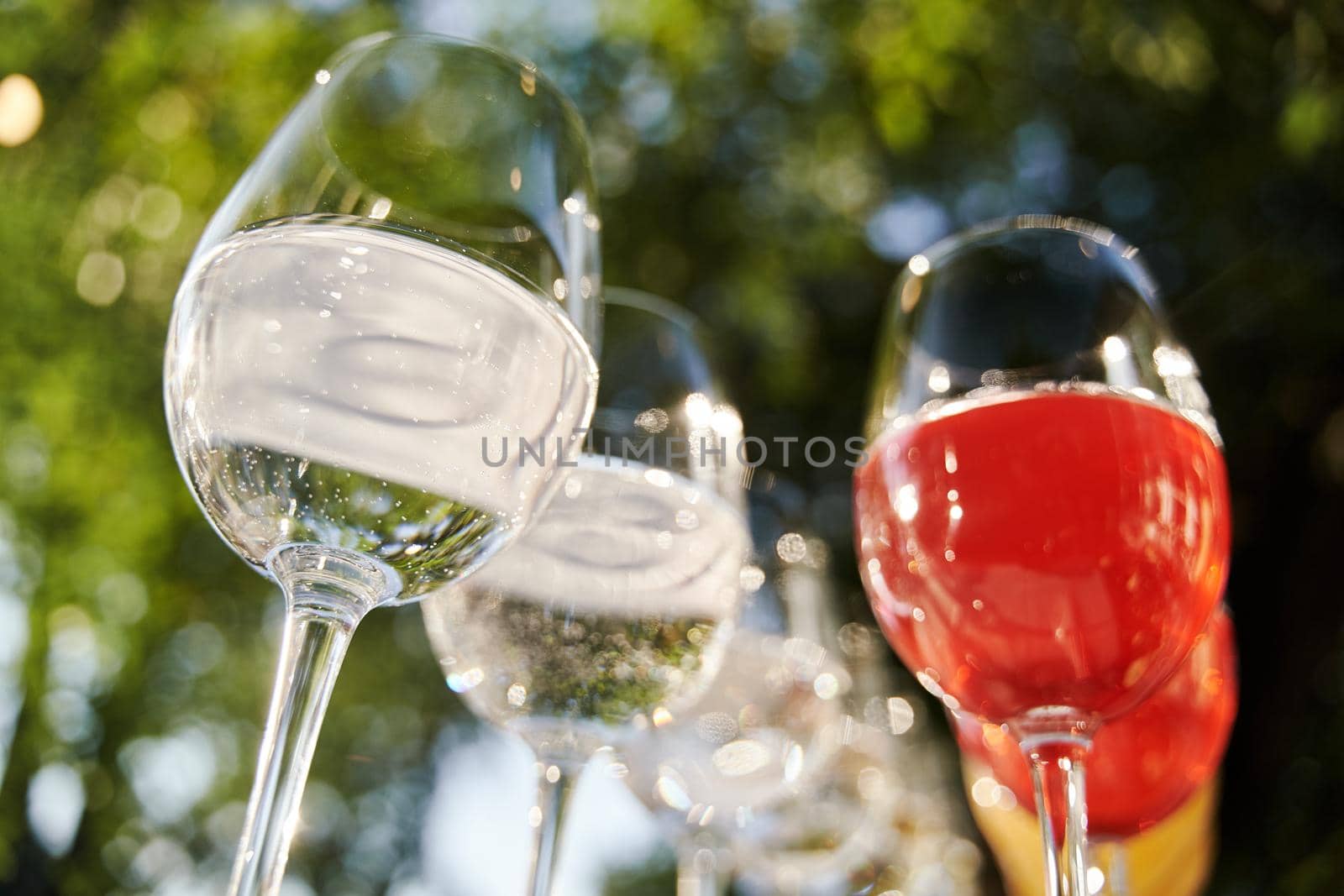 Table set for an event party or wedding reception. Banquet table design. Festive glasses with champagne and white wine.