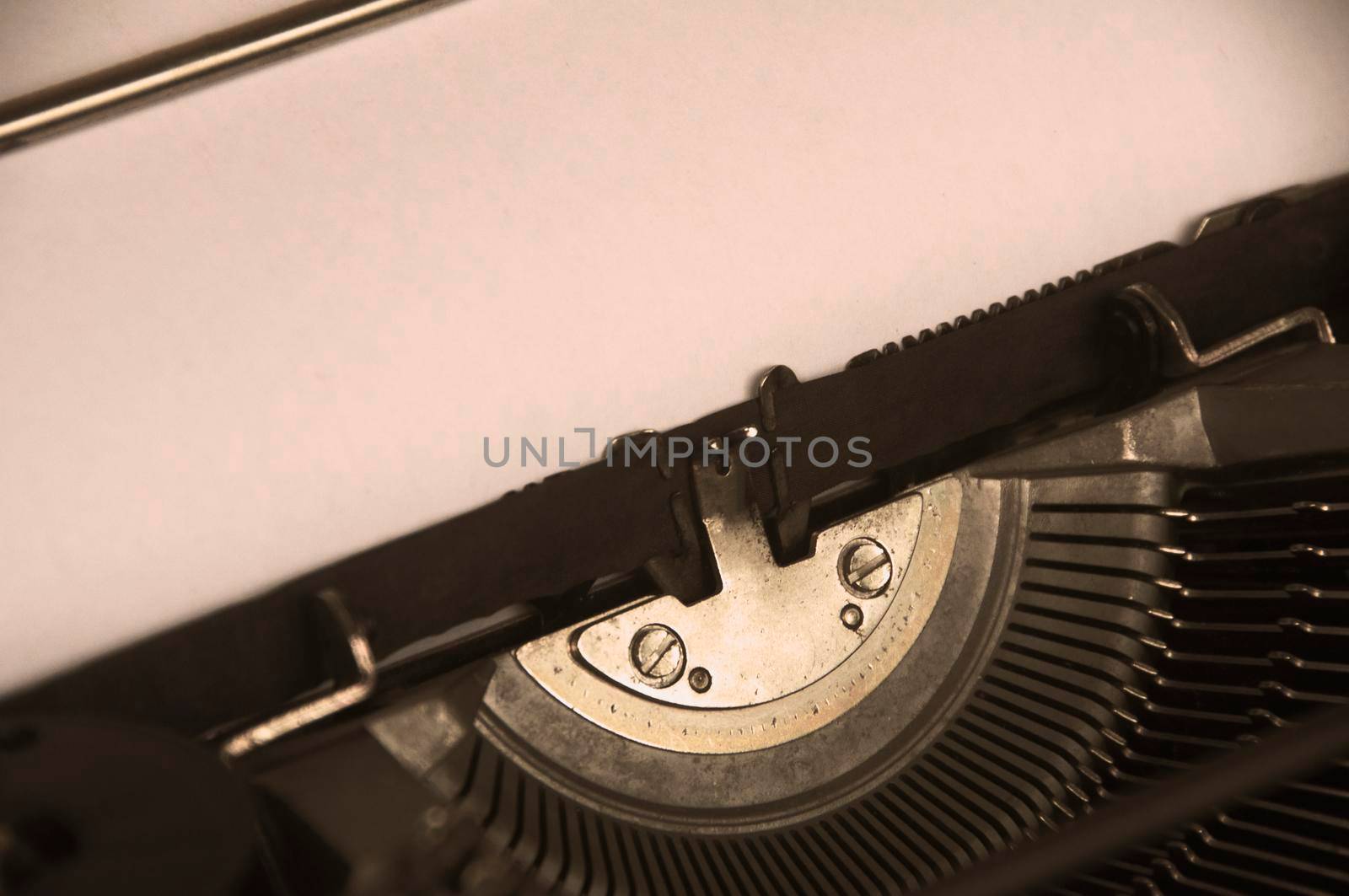 Side view of an old typewriter in vintage color. Copy space.