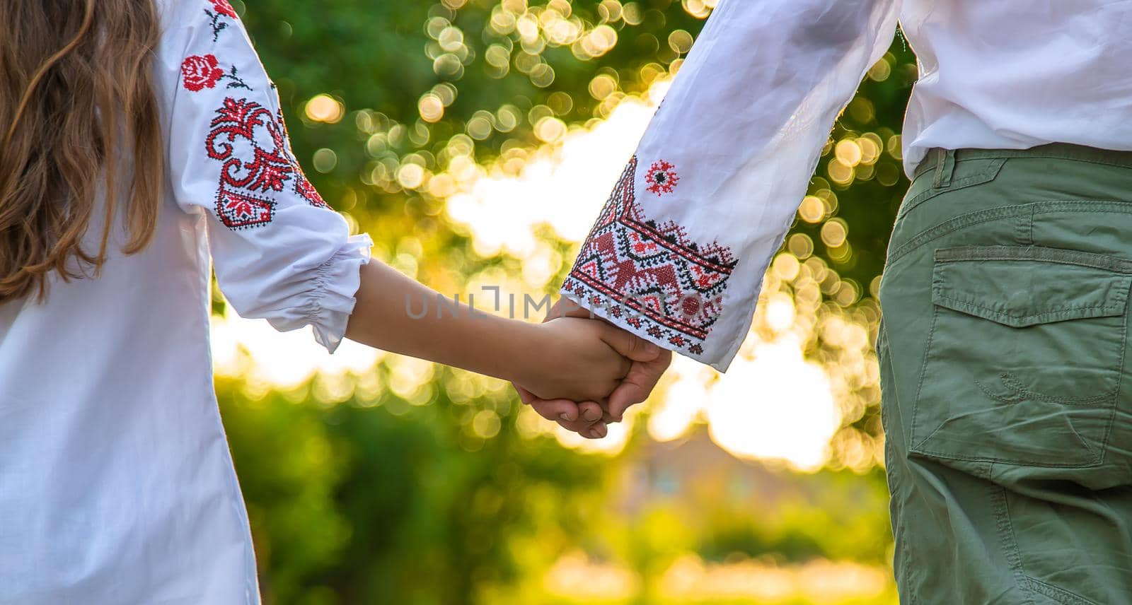 Ukrainian grandmother and granddaughter in vyshyvanka. selective focus. Kid.