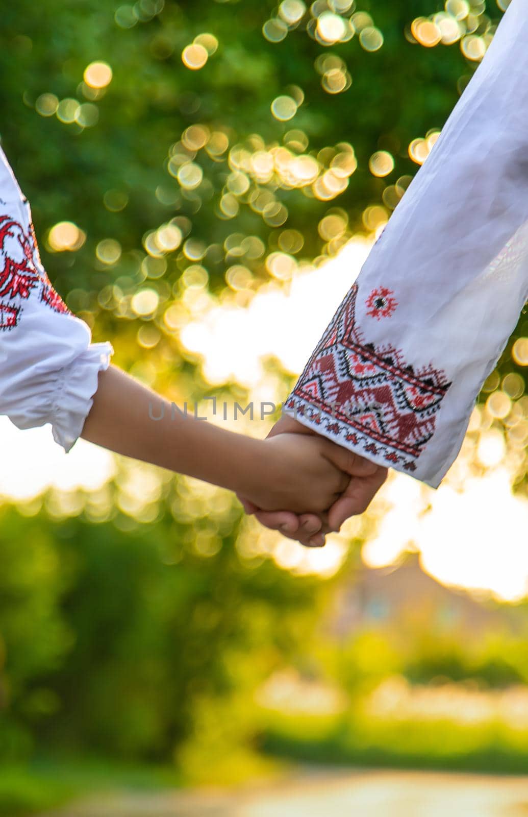 Ukrainian grandmother and granddaughter in vyshyvanka. selective focus. Kid.