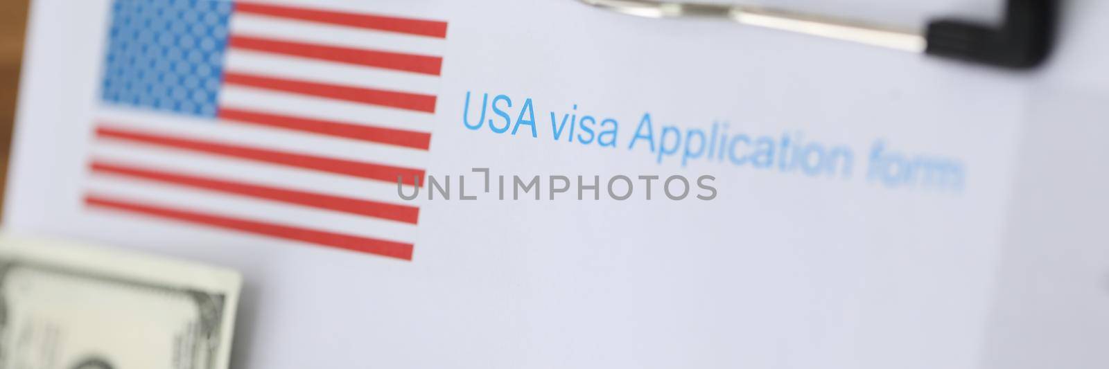 Documents for american visa and passport with money lying on table closeup. Assistance in paperwork for traveling abroad concept