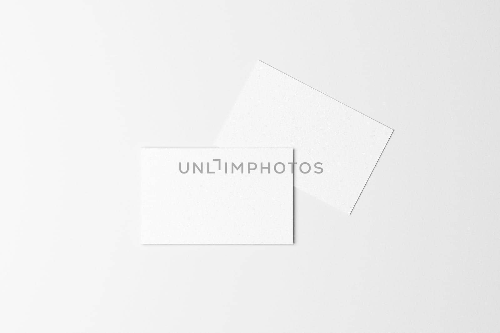 top view of white business card on white background for mockup. 3d render by Antonelli