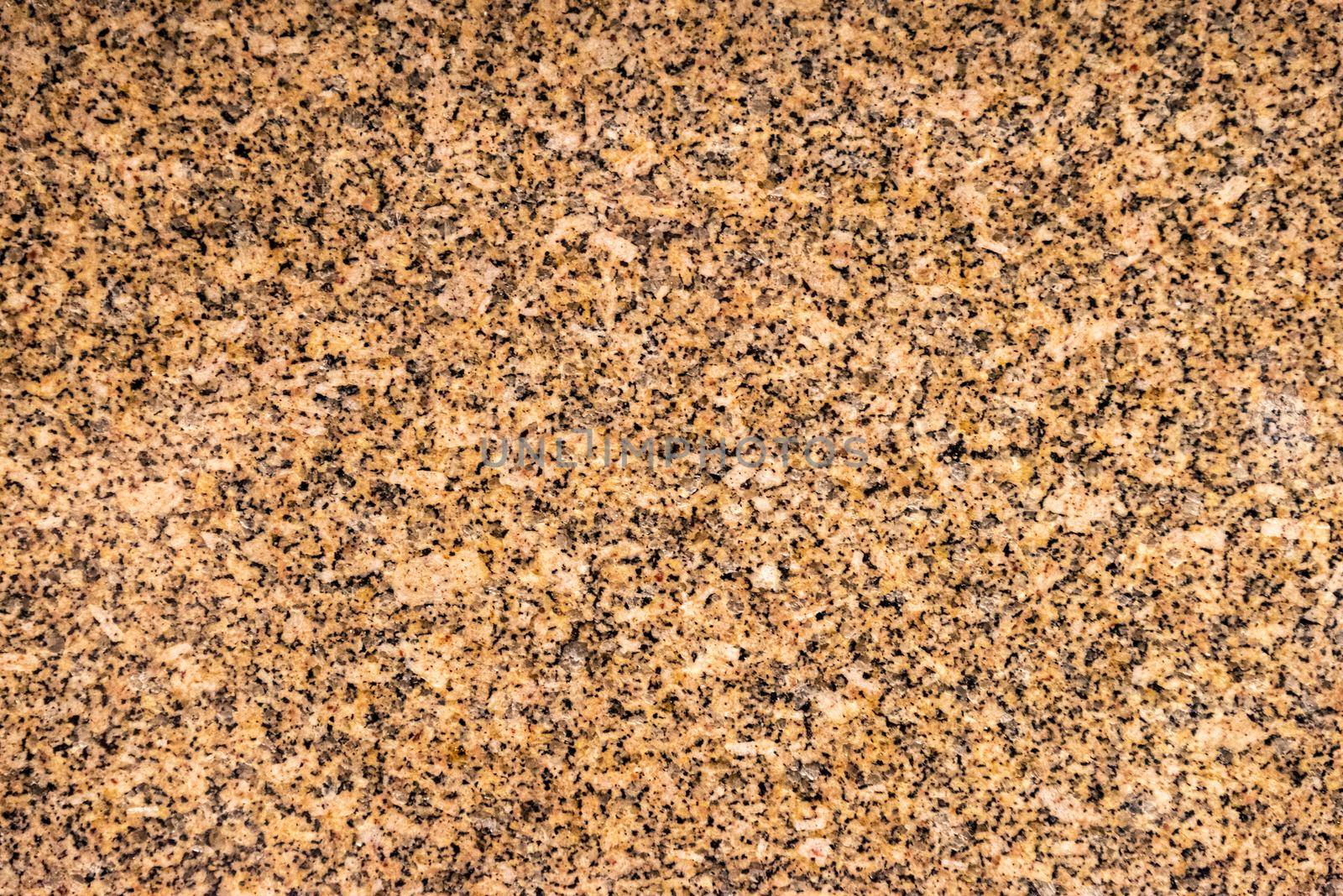 Decorative granite cut facet. Natural stone texture background.