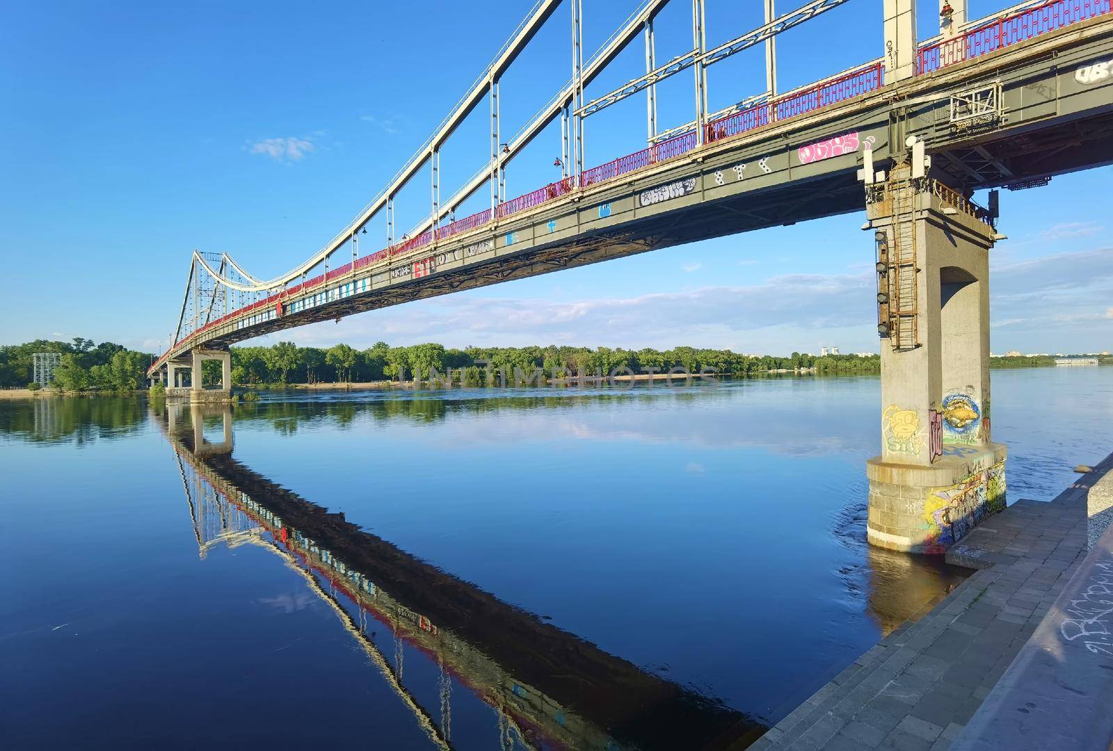 Kyiv, Ukraine - May 24, 2022: Landscape of the pedestrian bridge in Kiev. Summer time.