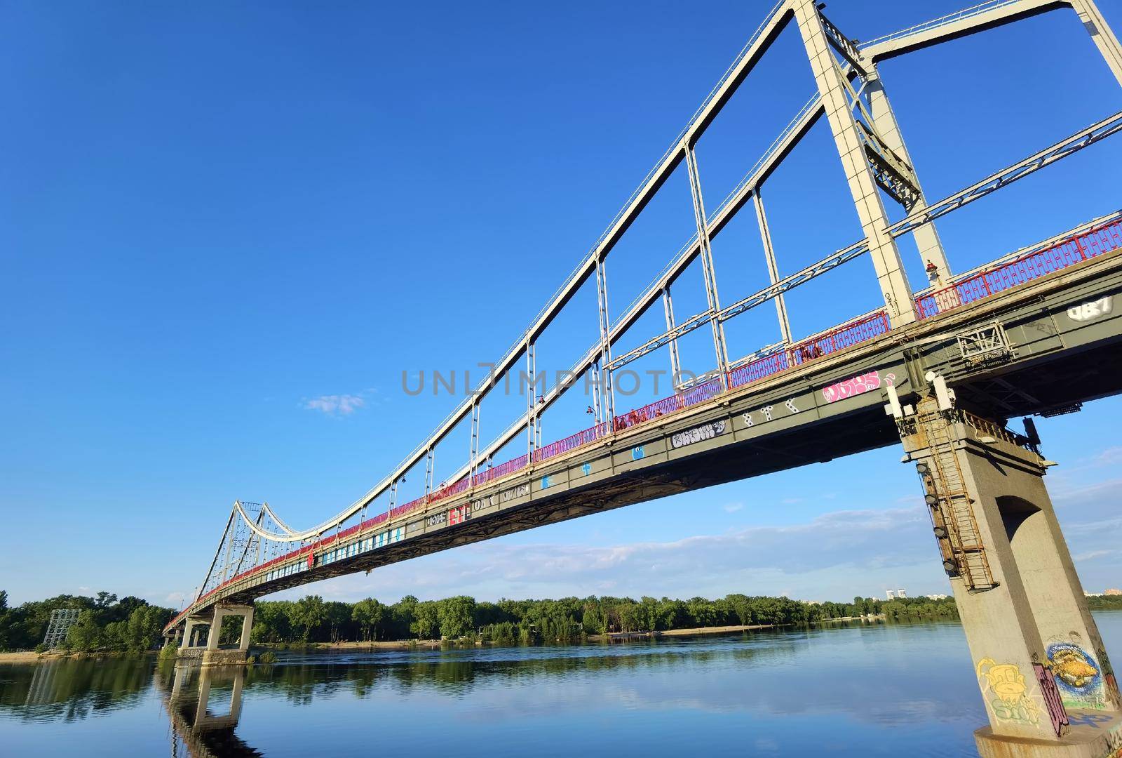 Kyiv, Ukraine - May 24, 2022: Landscape of the pedestrian bridge in Kiev. Summer time.