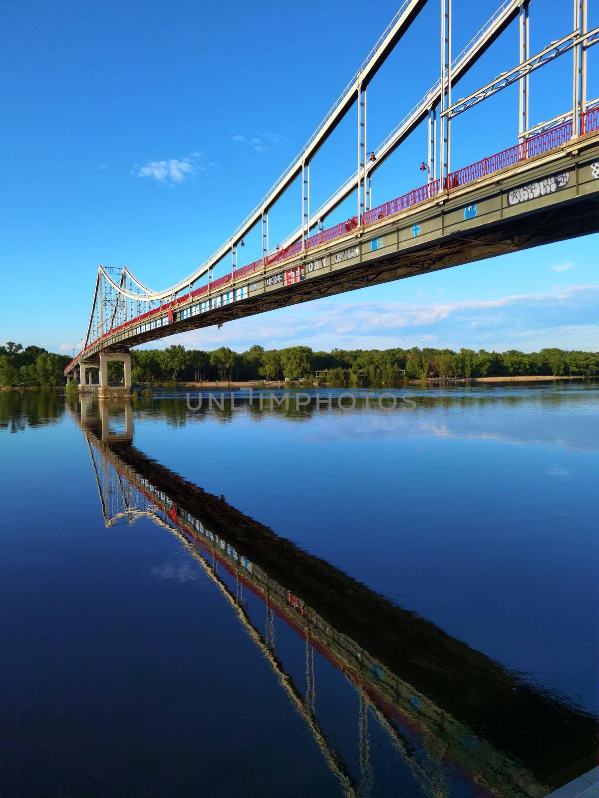 Kyiv, Ukraine - May 24, 2022: Landscape of the pedestrian bridge in Kiev. Summer time.