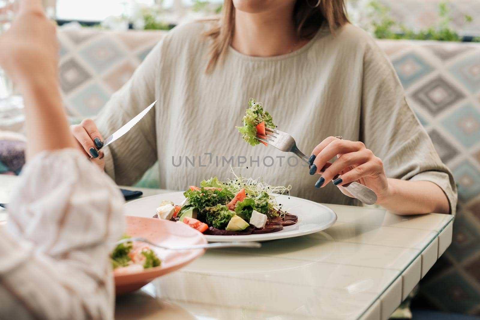 Close Up of Unrecognisable Women Having Lunch Meeting, Eating Salad in Restaurant