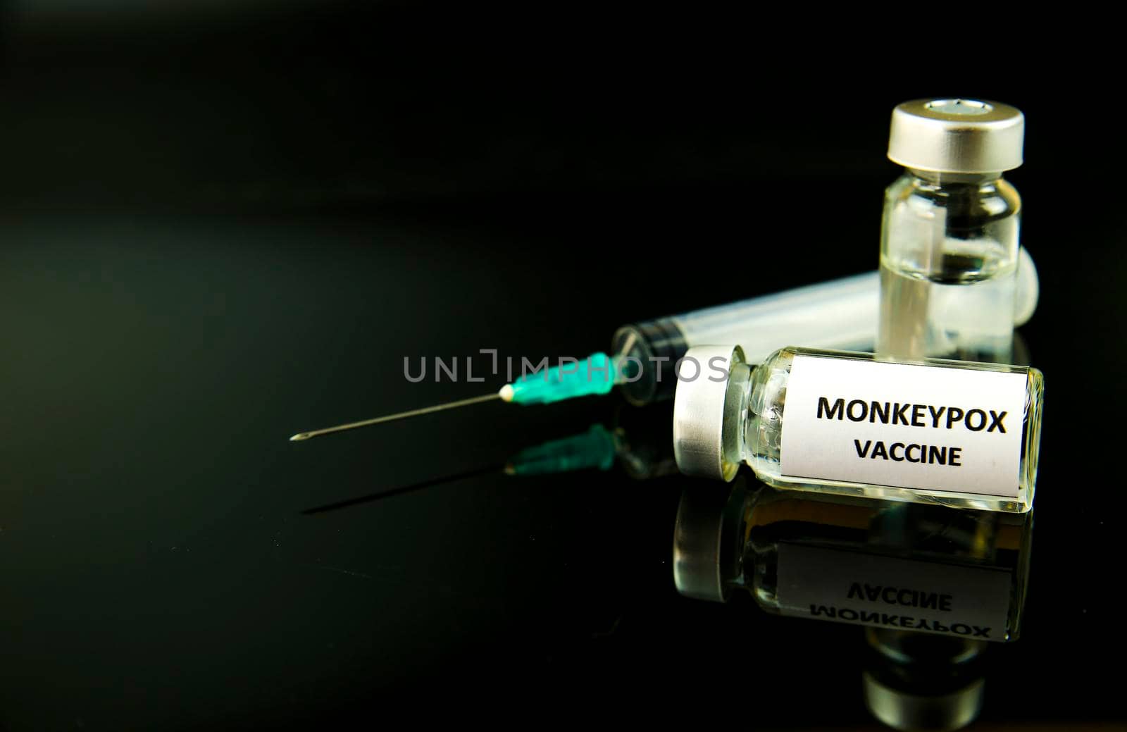 Vials filled and syringe with Monkeypox vaccine by soniabonet