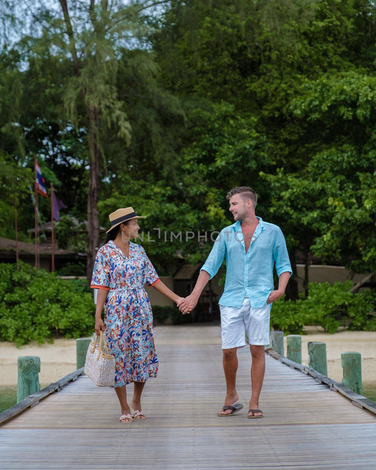 couple men and woman on a tropical isalnd with wooden pier jetty, by fokkebok