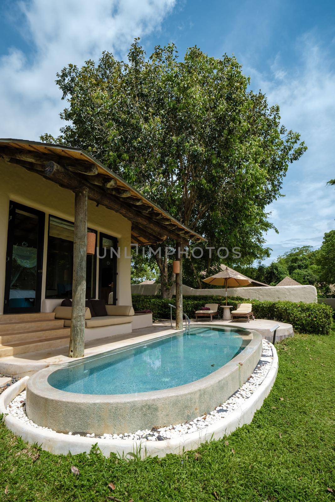 infinity pool in Thailand looking out over the ocean, luxury vacation in Thailand, private pool villa. by fokkebok