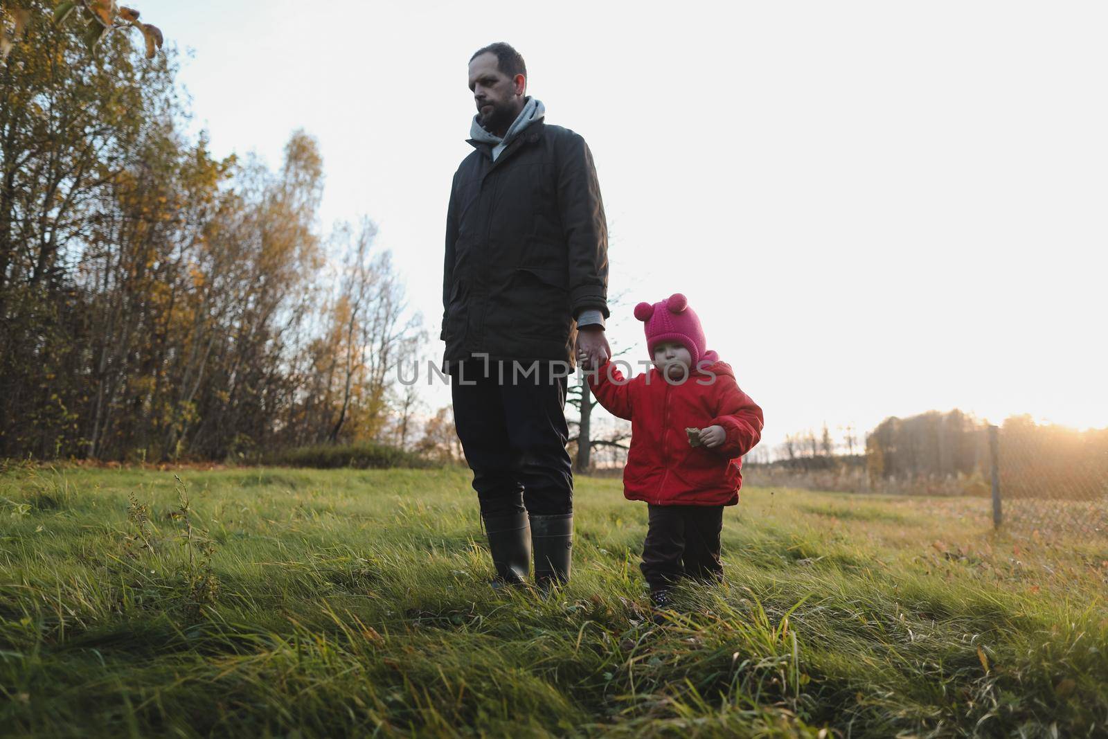 Happy father and child spending time outdoors. father with daughter in autumn park.